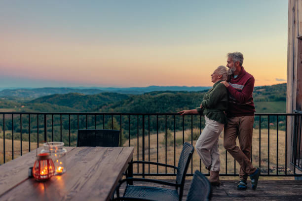 Couple on resort deck at sunset